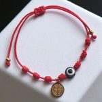 Pulsera  negra 7 nudos  San Benito y ojo turco